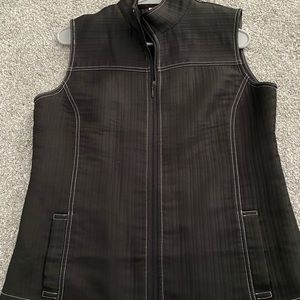 Black vest with white stitching. Never worn! Great for layering.